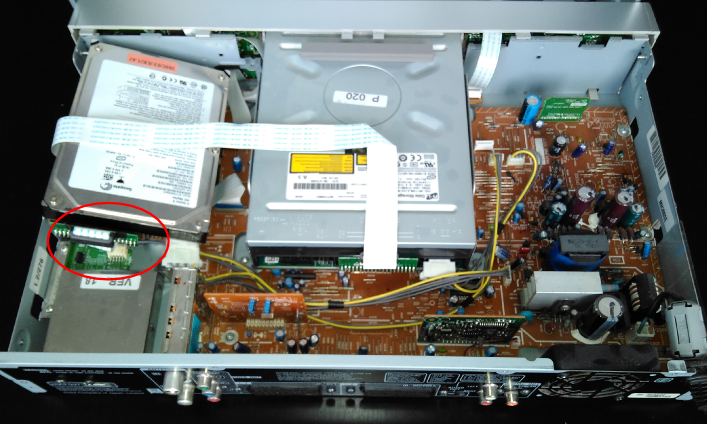 Unscrew the drive, disconnect it from the rest of the device (connector in the red circle).
